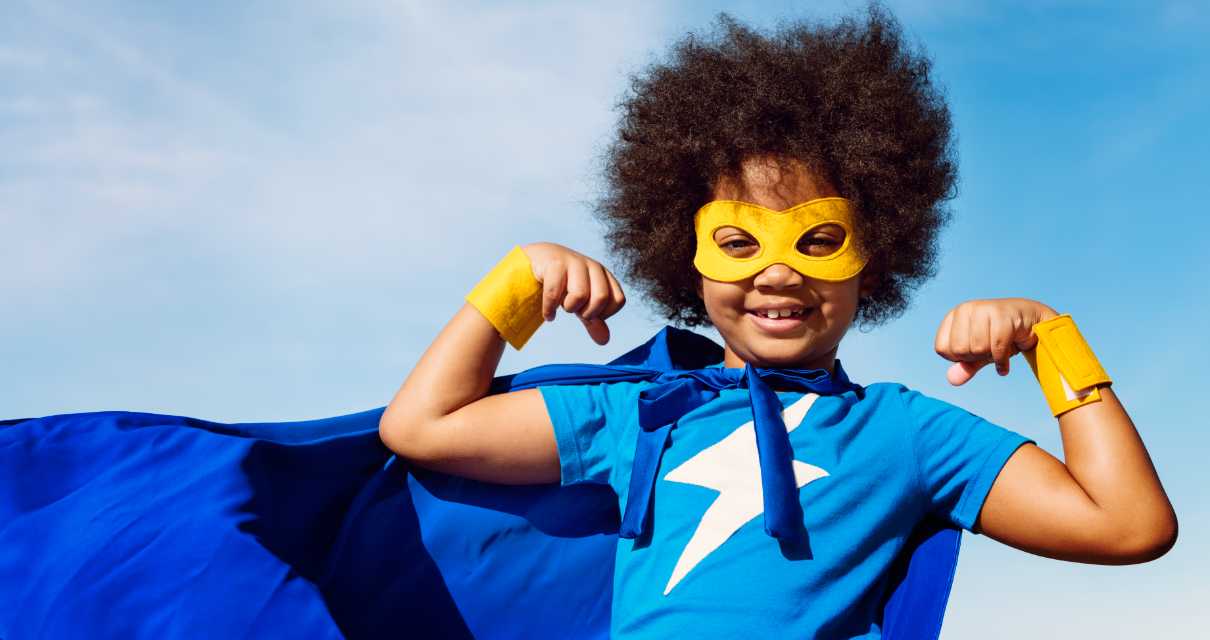 boy wearing a superhero outfit