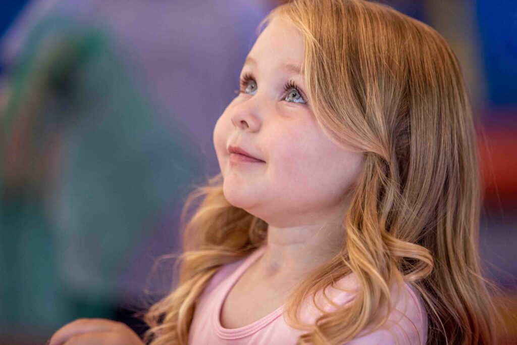 young girl looking up